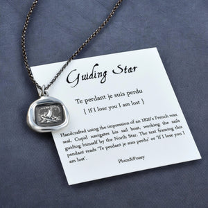 a necklace with a card attached to it