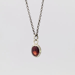 Garnet pendant in sterling silver bezel