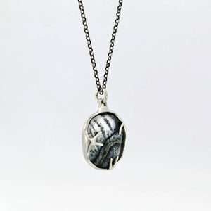 Dendritic opal pendant in hybrid bezel with decorative prongs