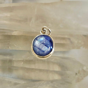 Light blue sapphire pendant in sterling silver bezel