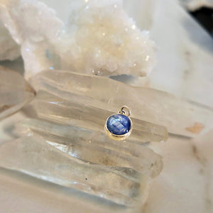 Light blue sapphire pendant in sterling silver bezel