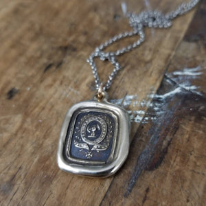 Fist anf Anchor - Courage and Challenge in bronze