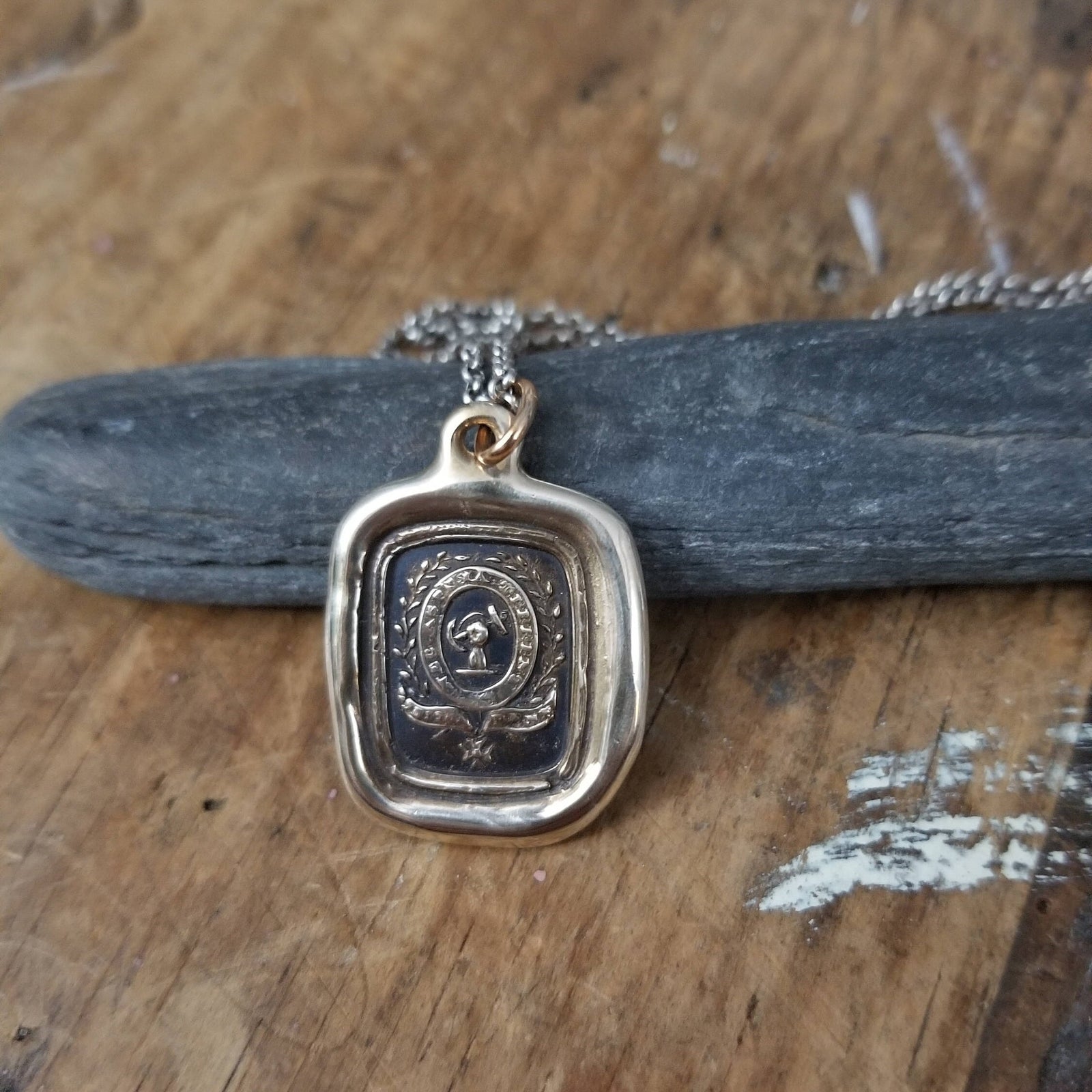 Fist anf Anchor - Courage and Challenge in bronze