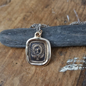 Fist anf Anchor - Courage and Challenge in bronze