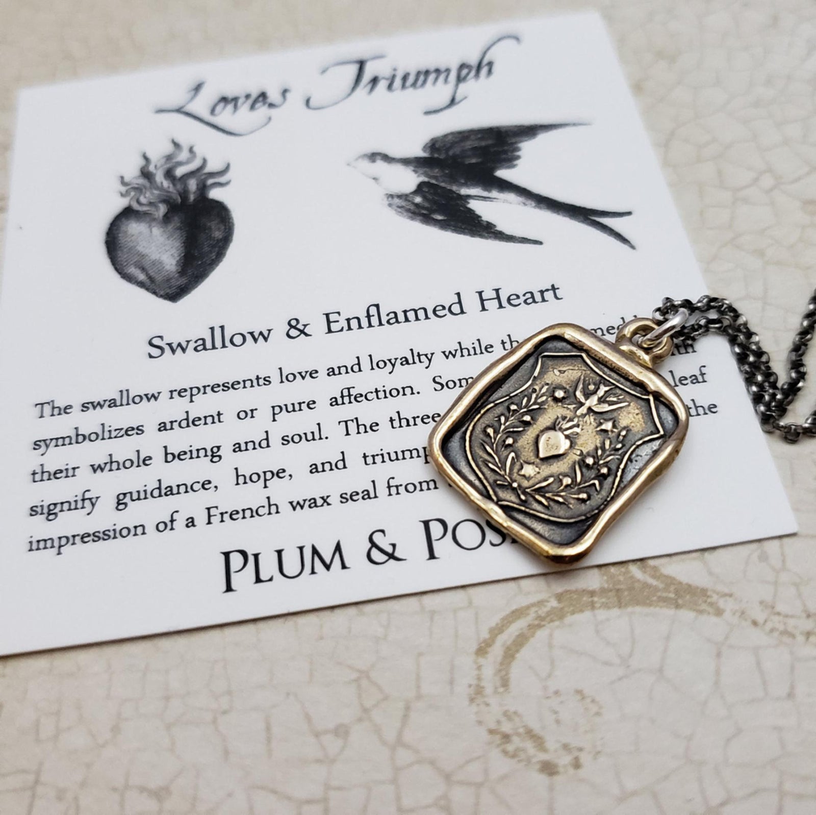 Swallow and Enflamed Heart Necklace in Bronze
