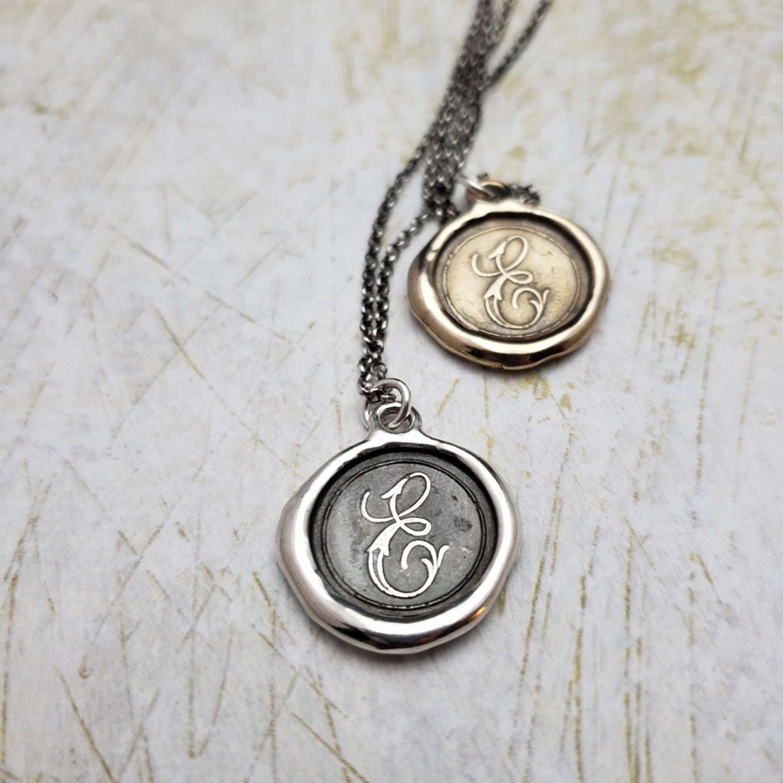 Initial E in Bronze