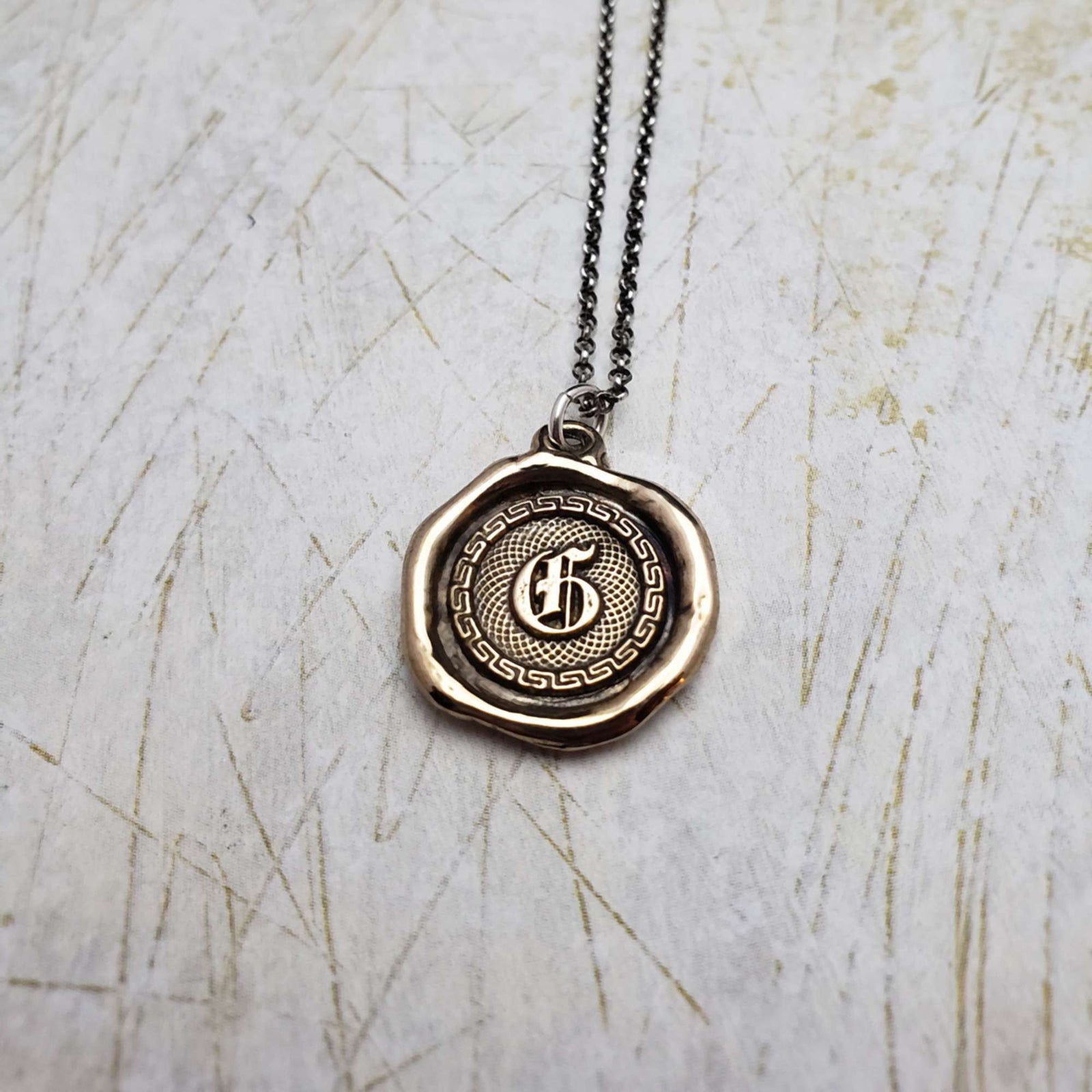 Letter G in Bronze