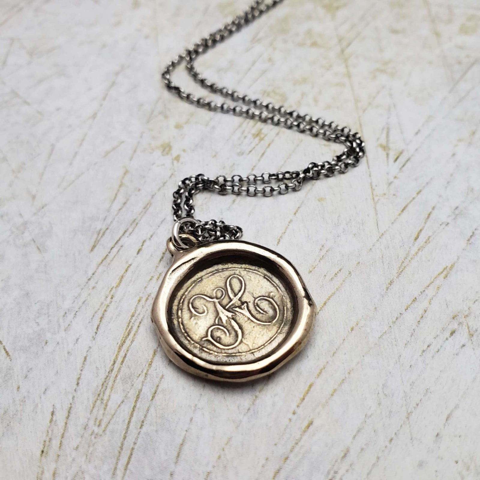 Initial H in Bronze