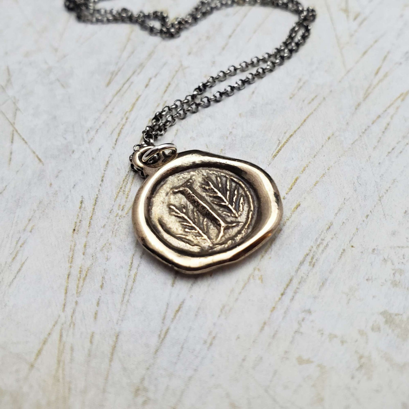 Initial I in Bronze