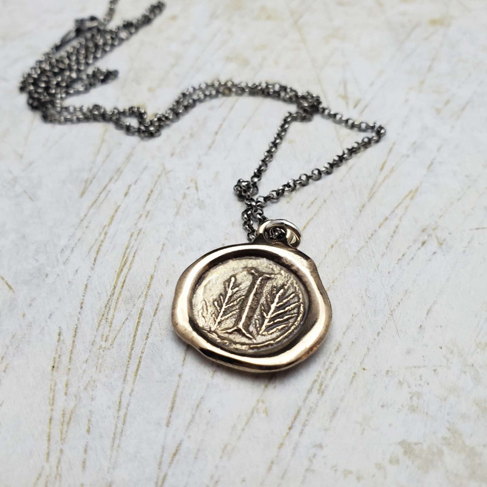 Initial I in Bronze