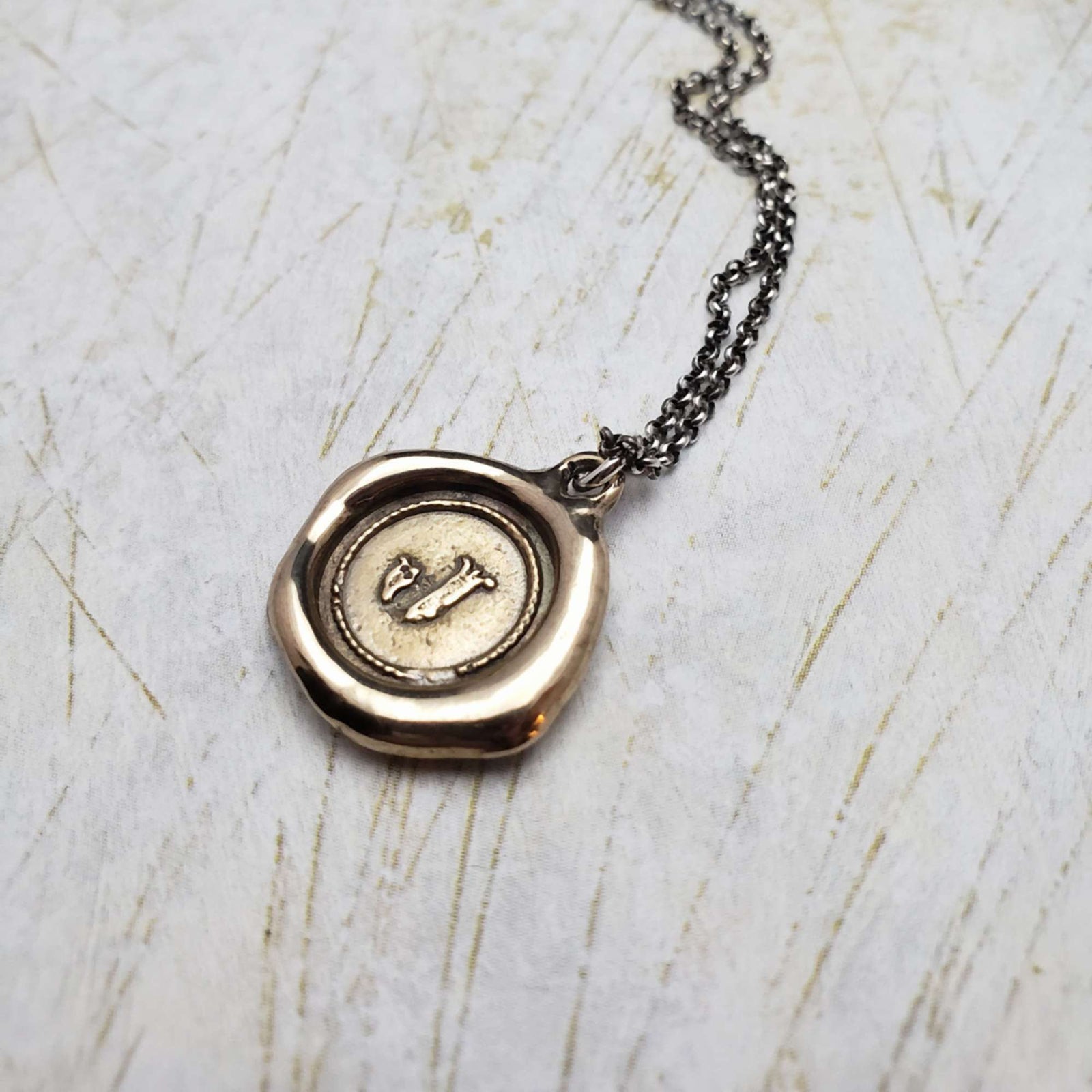 Initial J in Bronze
