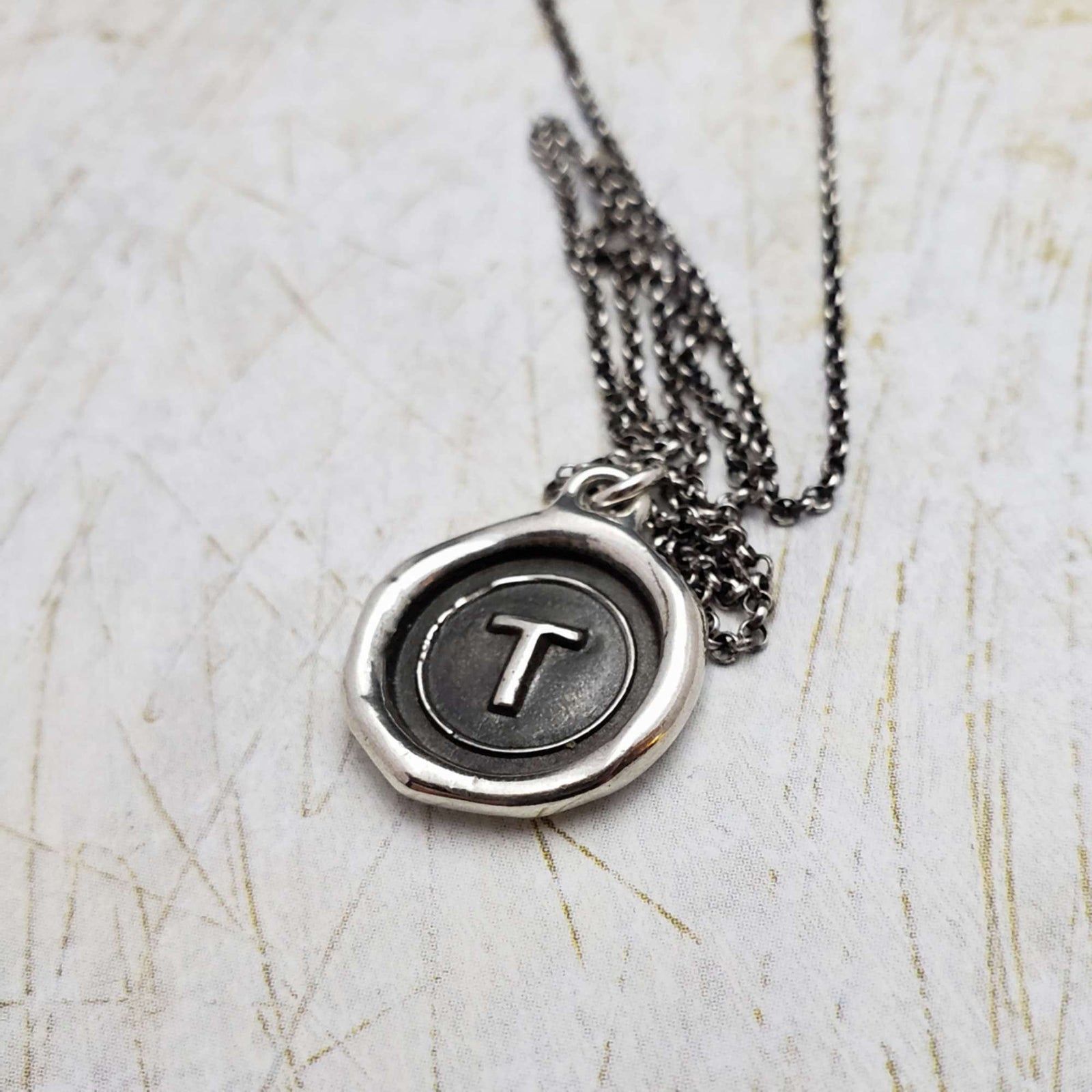 Initial T