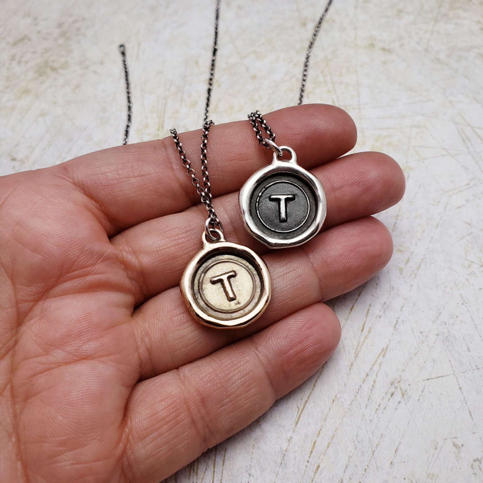 Initial T in Bronze