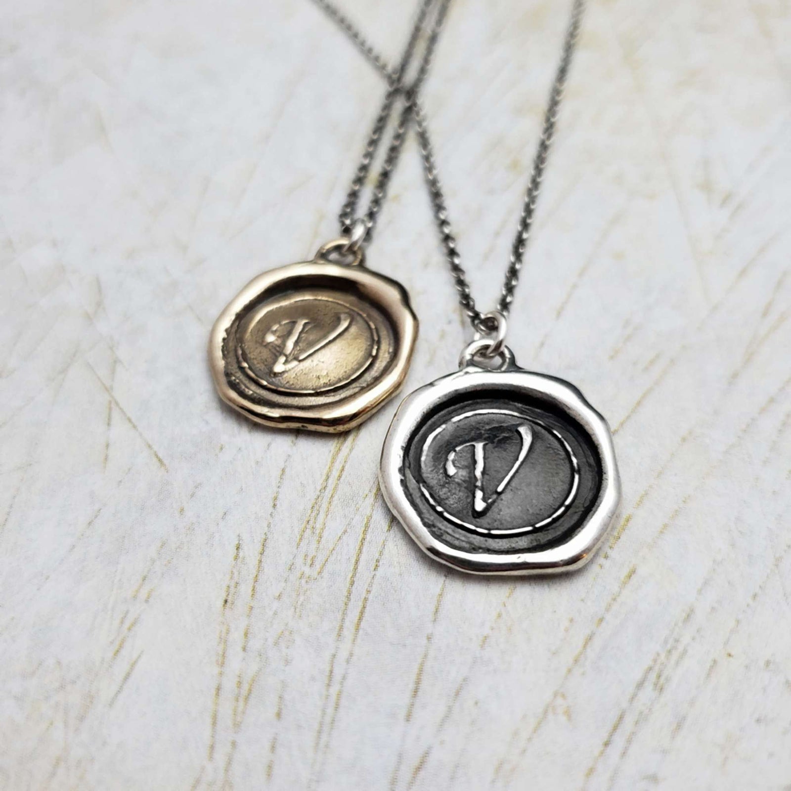 Initial V in Bronze