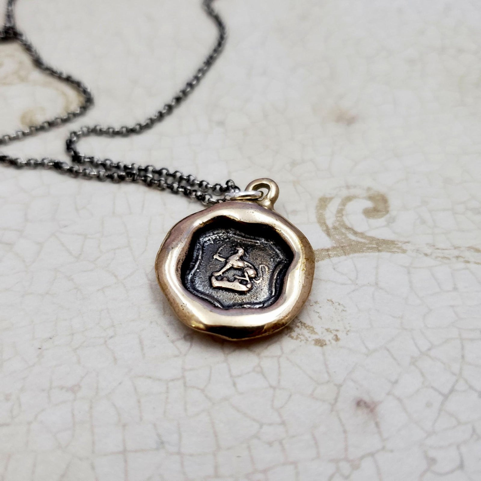 Dog and Sword Protection Necklace in bronze