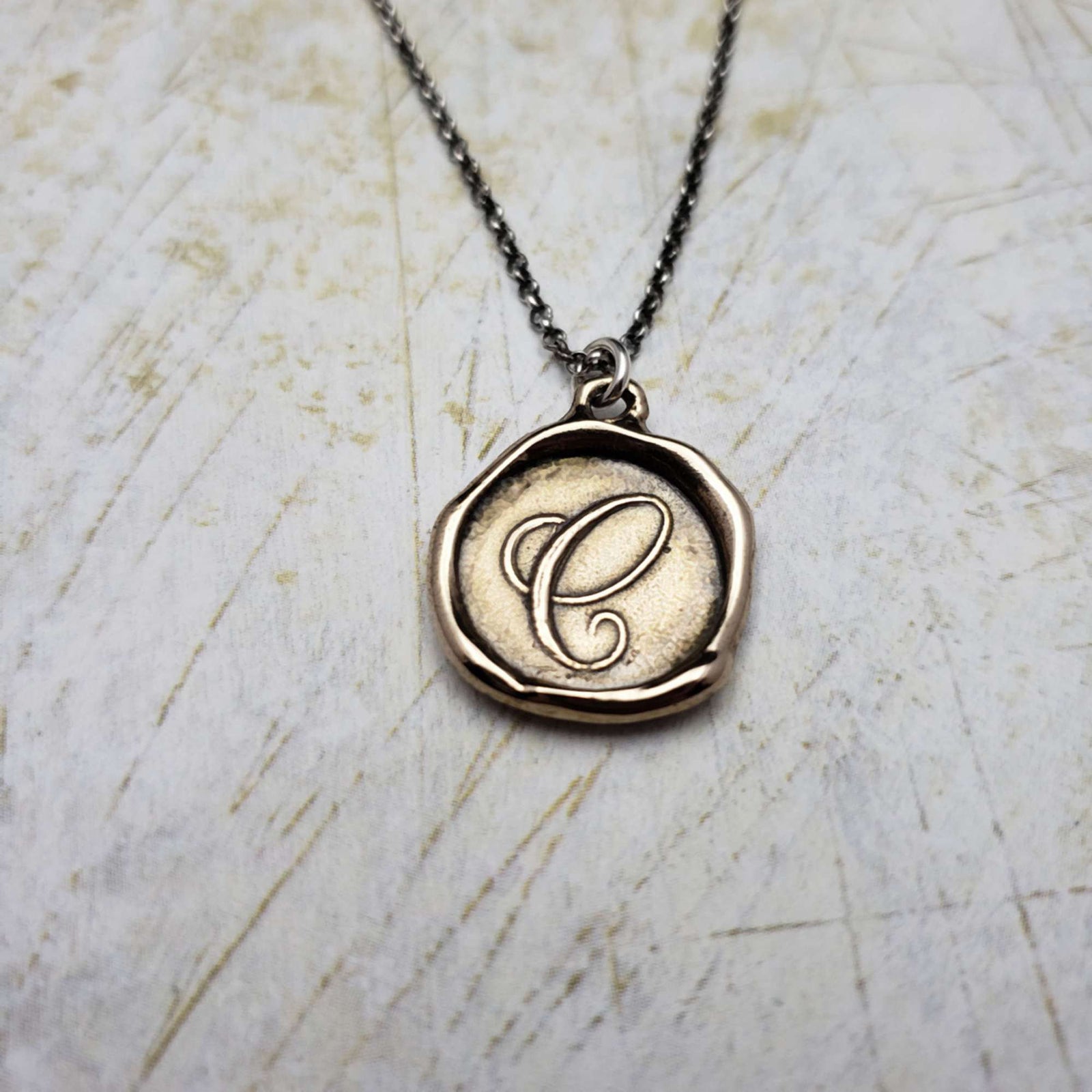 Initial C in Bronze