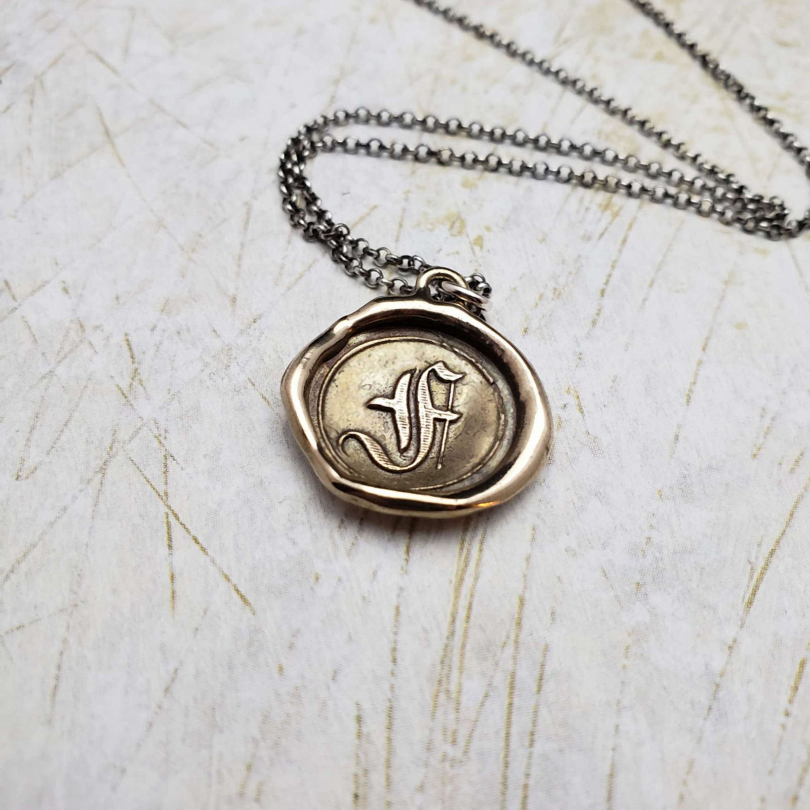 Initial F in Bronze