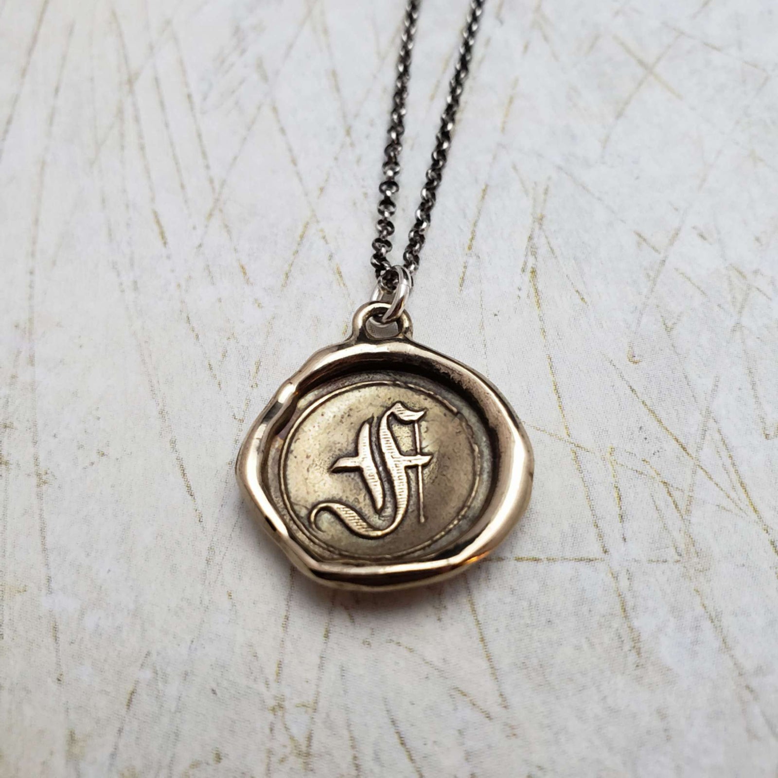 Initial F in Bronze