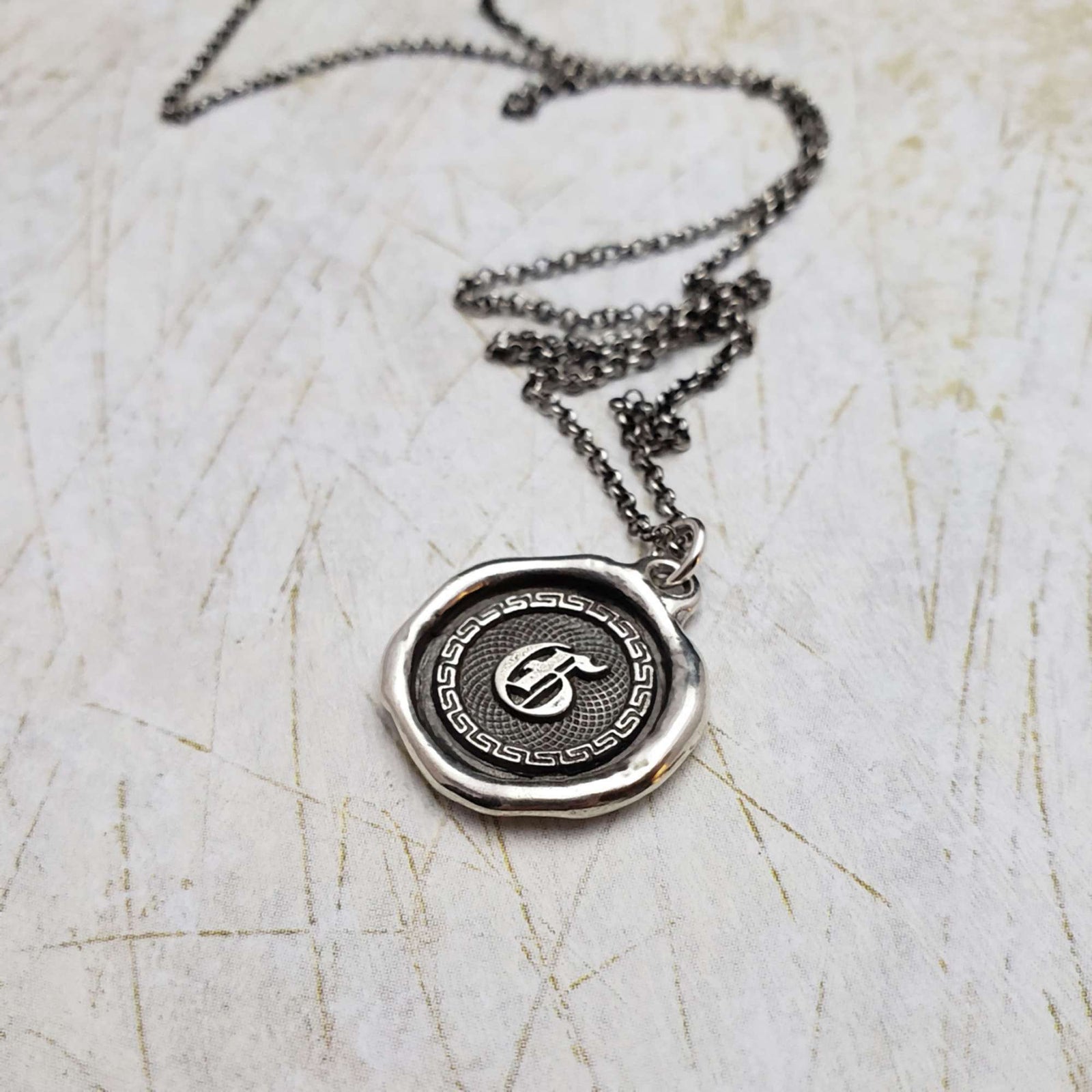 Initial G