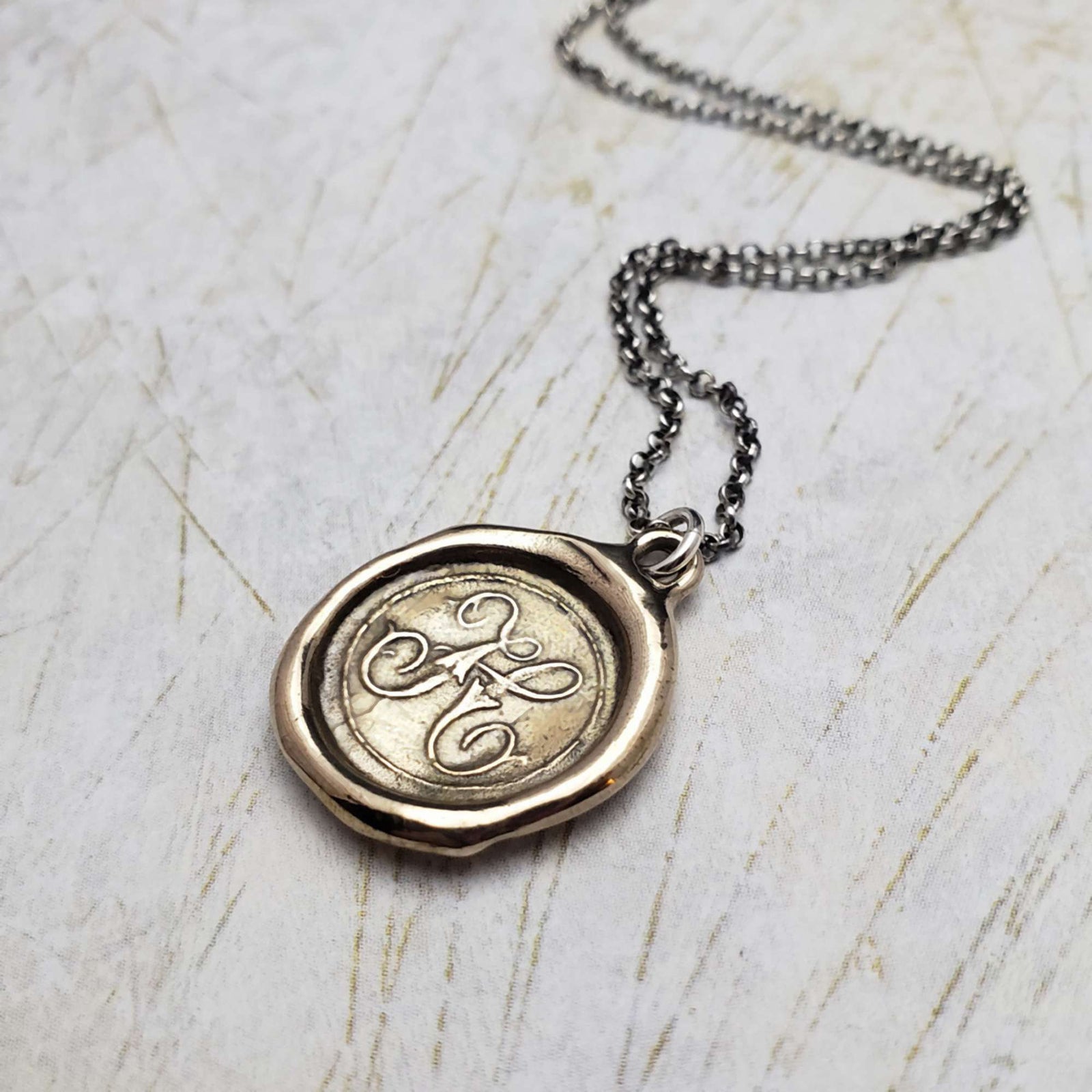 Initial H in Bronze