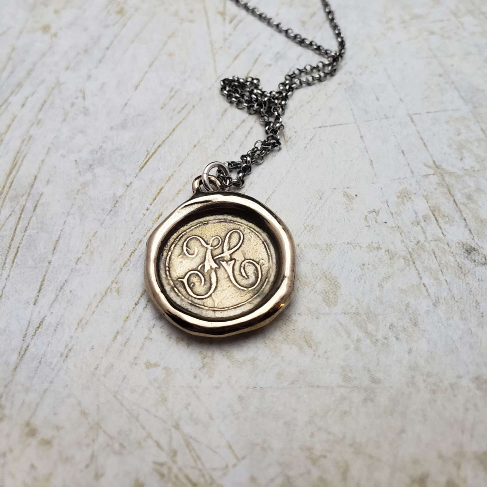 Initial H in Bronze