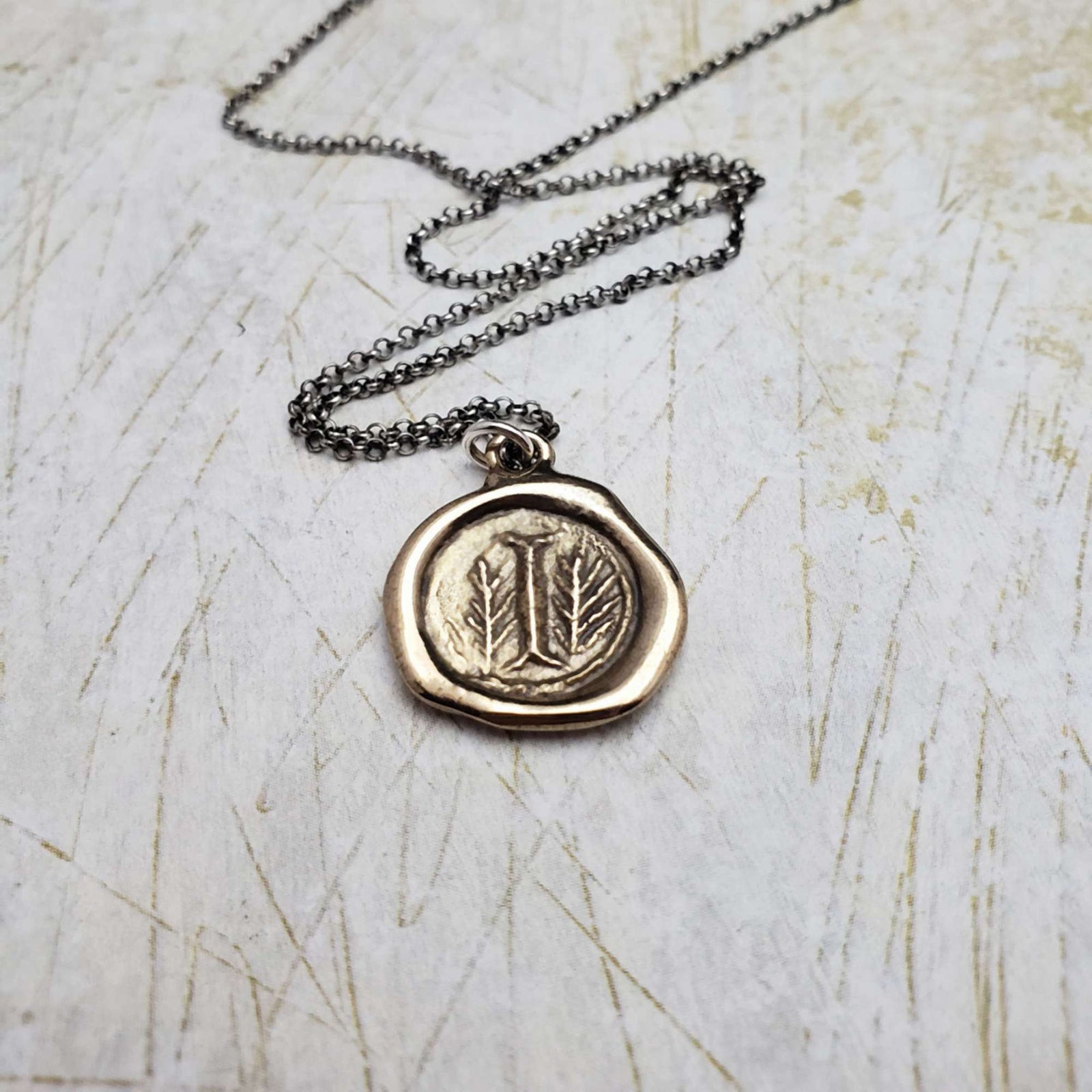 Initial I in Bronze