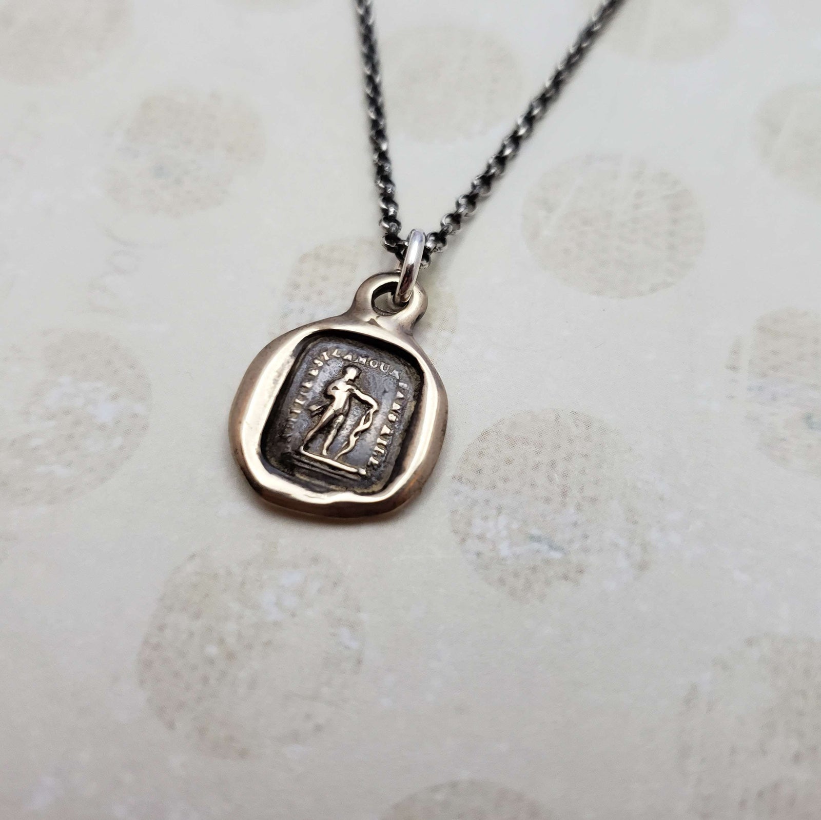 Friendship is love without his wings in bronze