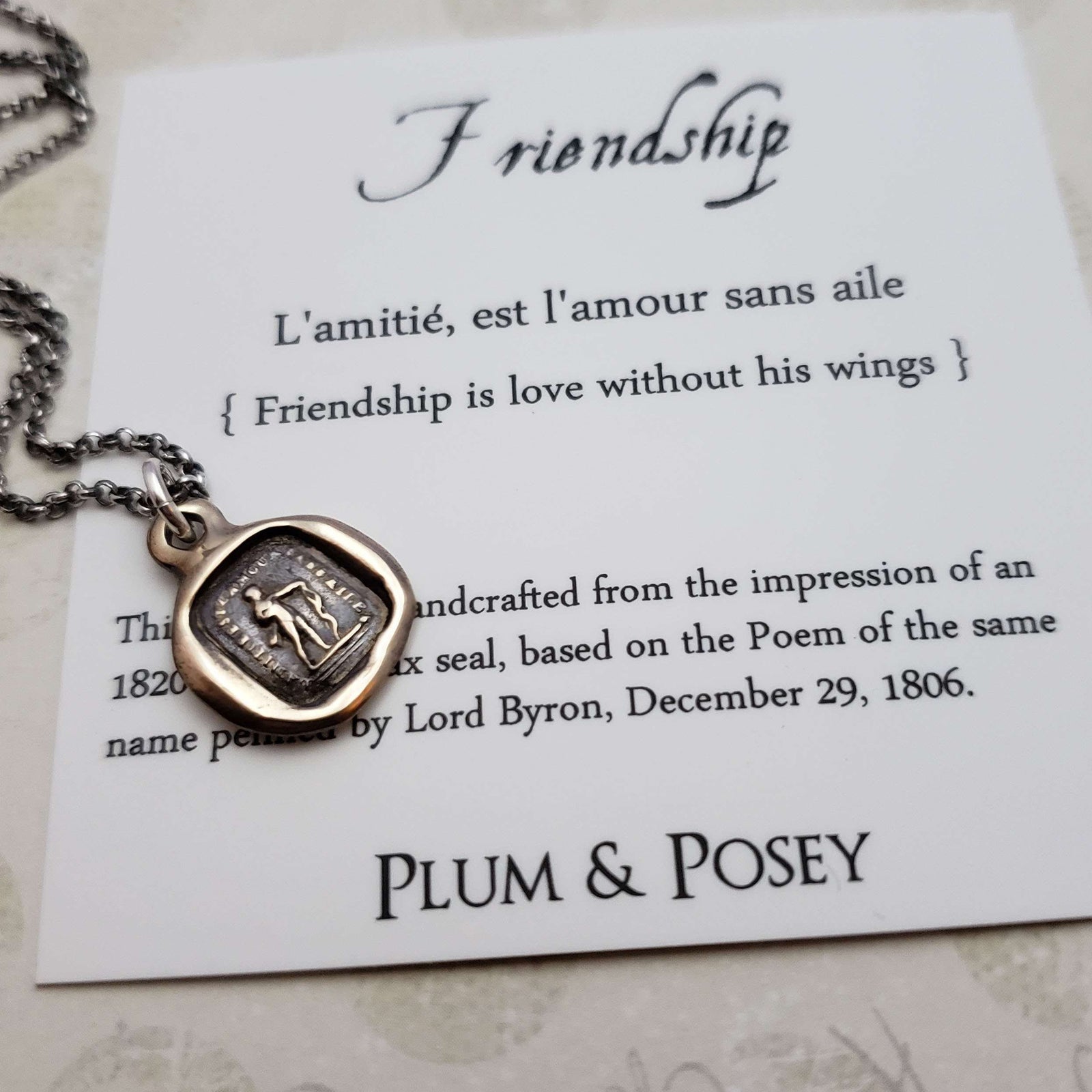 Friendship is love without his wings in bronze