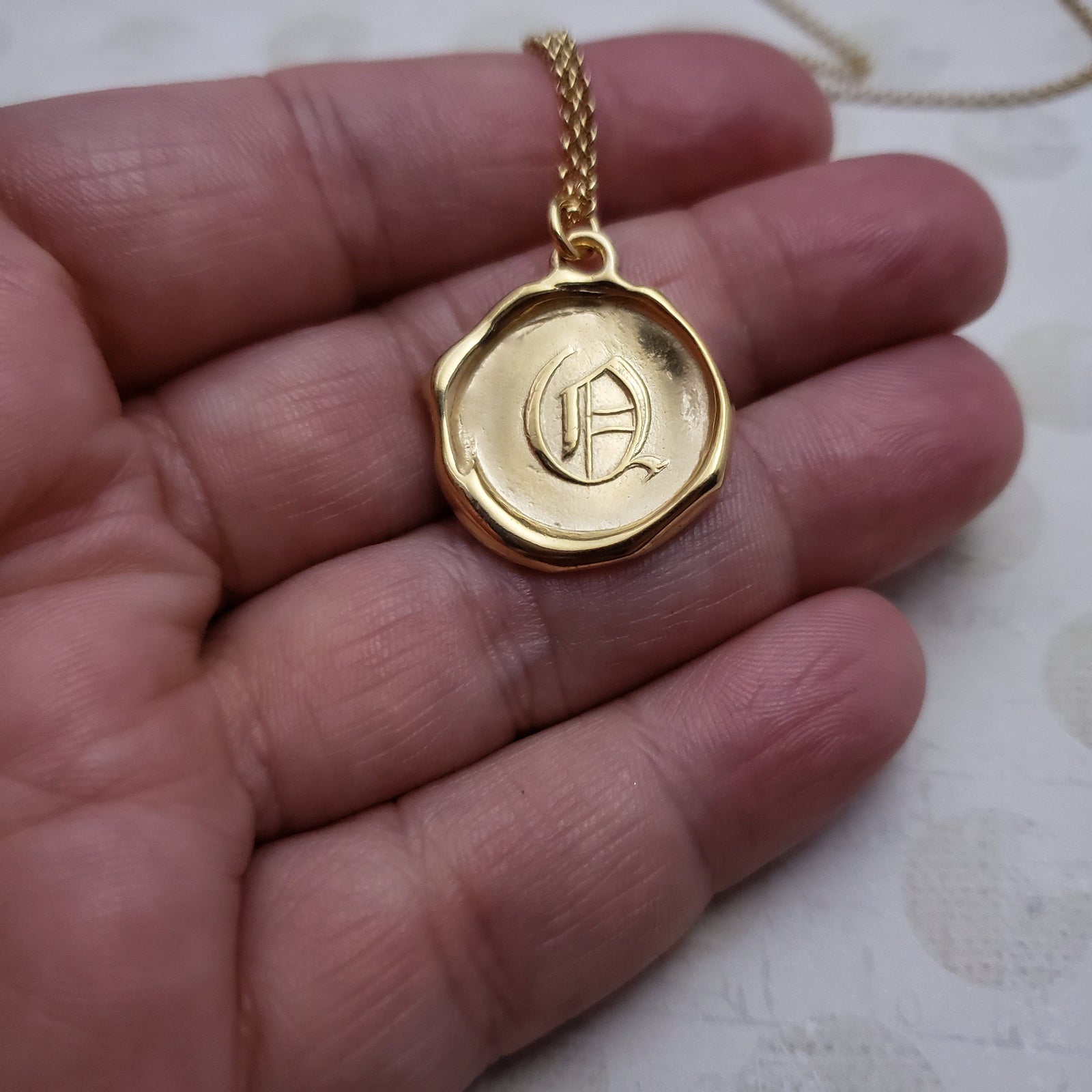 Letter Q in gold vermeil