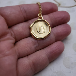 Letter Q in gold vermeil
