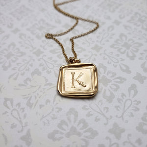 Letter K in gold vermeil