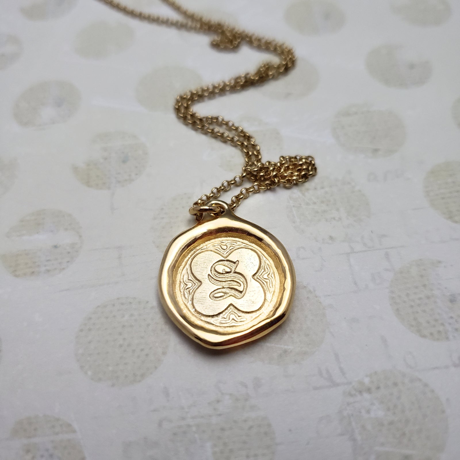 Letter S in gold vermeil