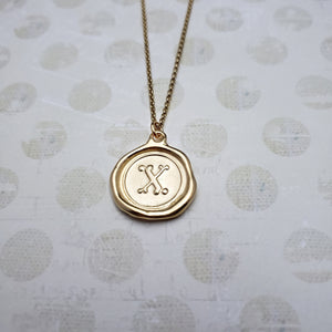Letter X in gold vermeil
