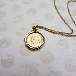 Letter Q in gold vermeil