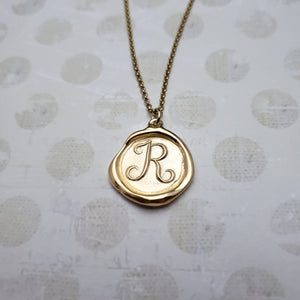 Letter R in gold vermeil