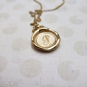 Letter P in gold vermeil