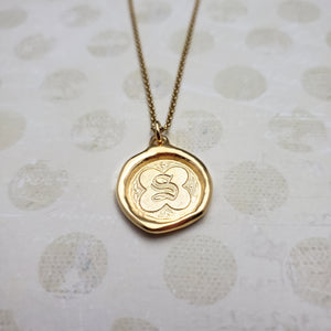 Letter S in gold vermeil