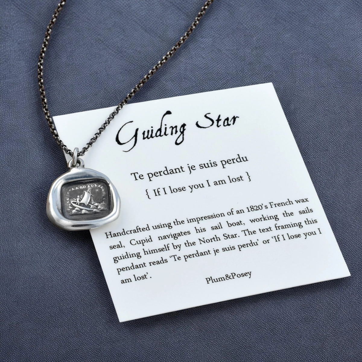 a necklace with a card attached to it