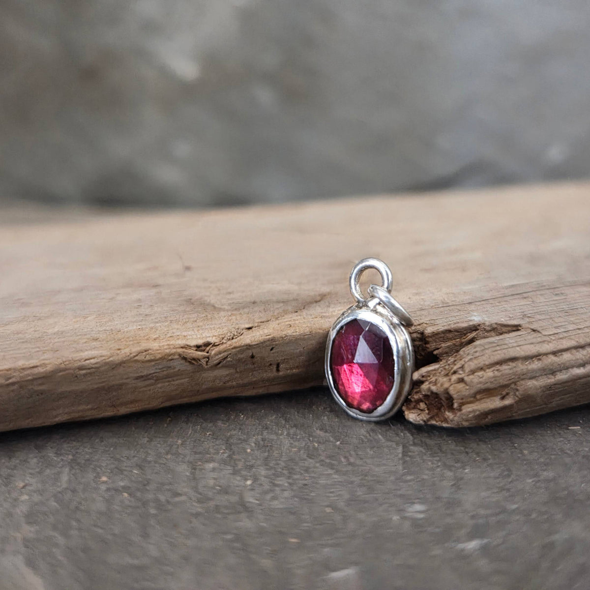 Garnet pendant in sterling silver bezel