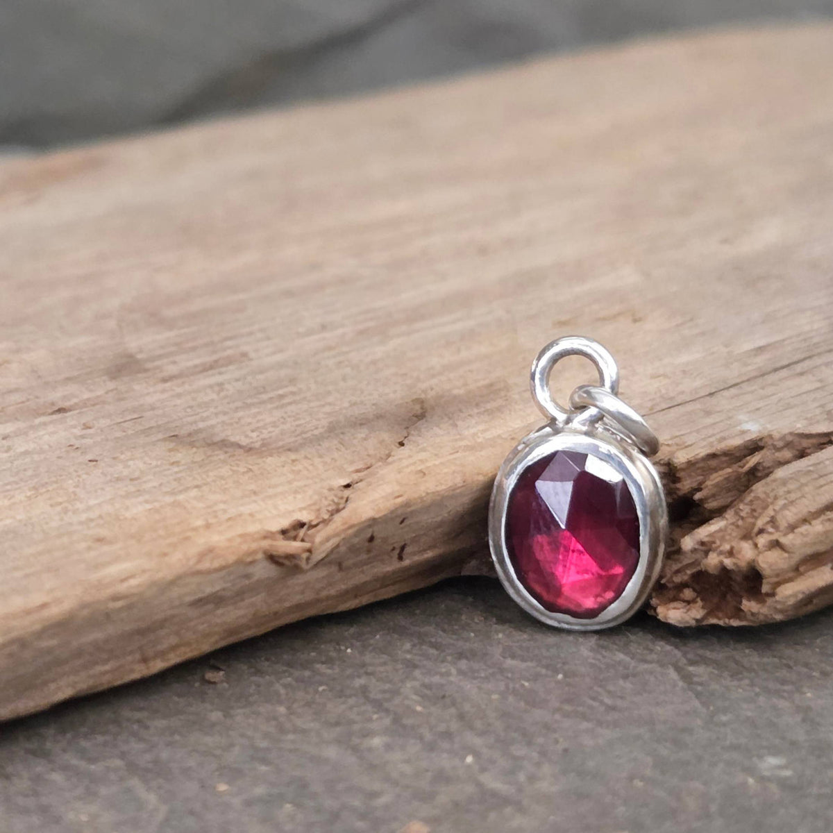 Garnet pendant in sterling silver bezel