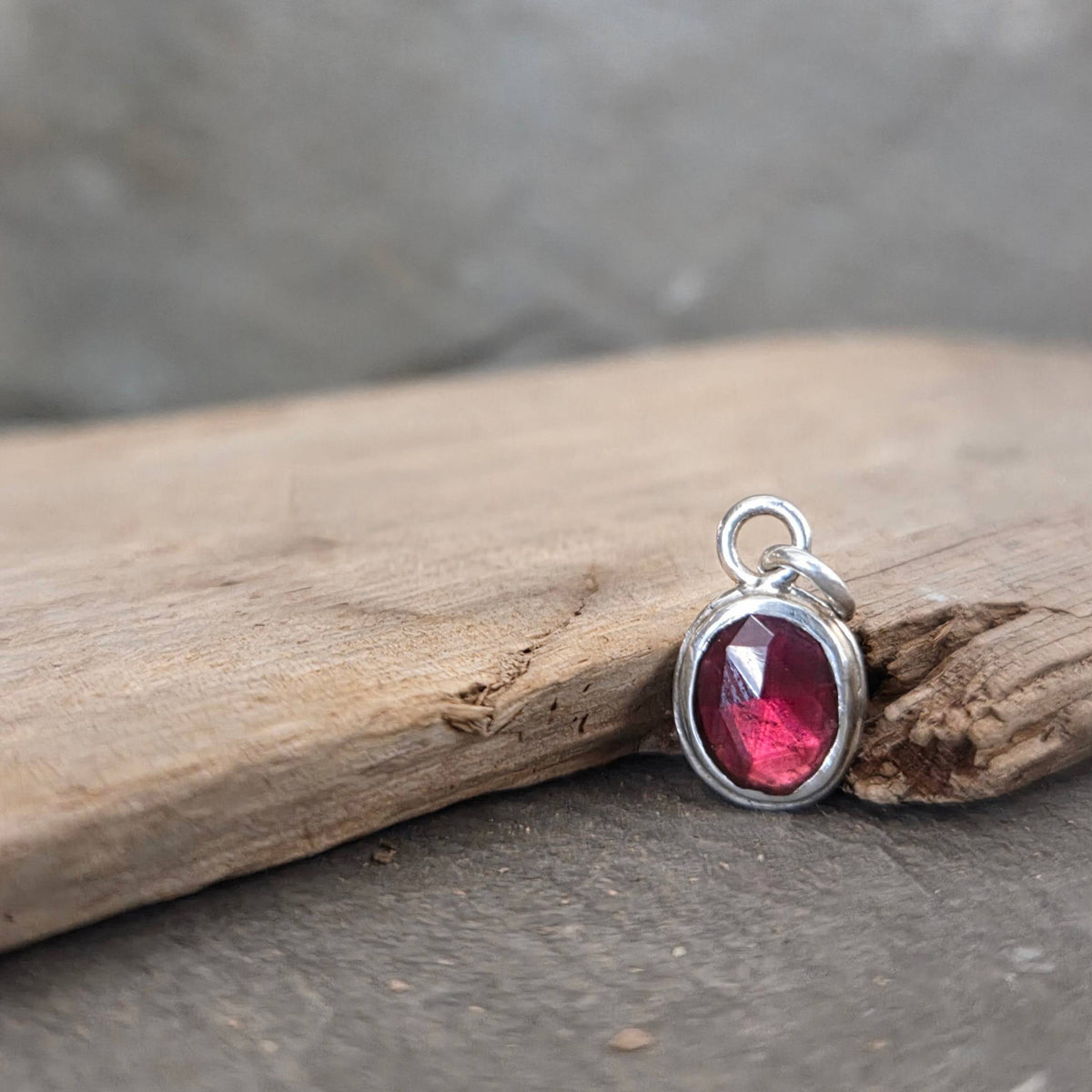Garnet pendant in sterling silver bezel
