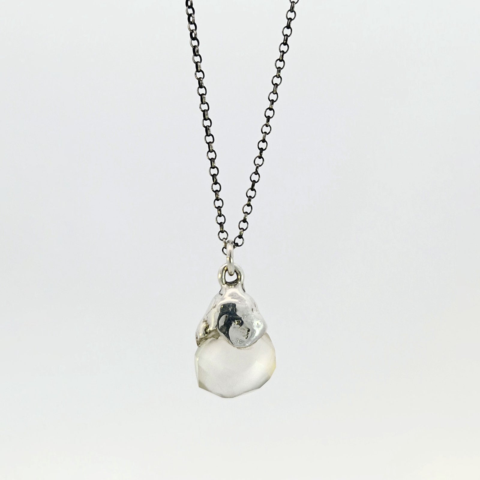 Grey chalcedony pendant with sterling silver cap