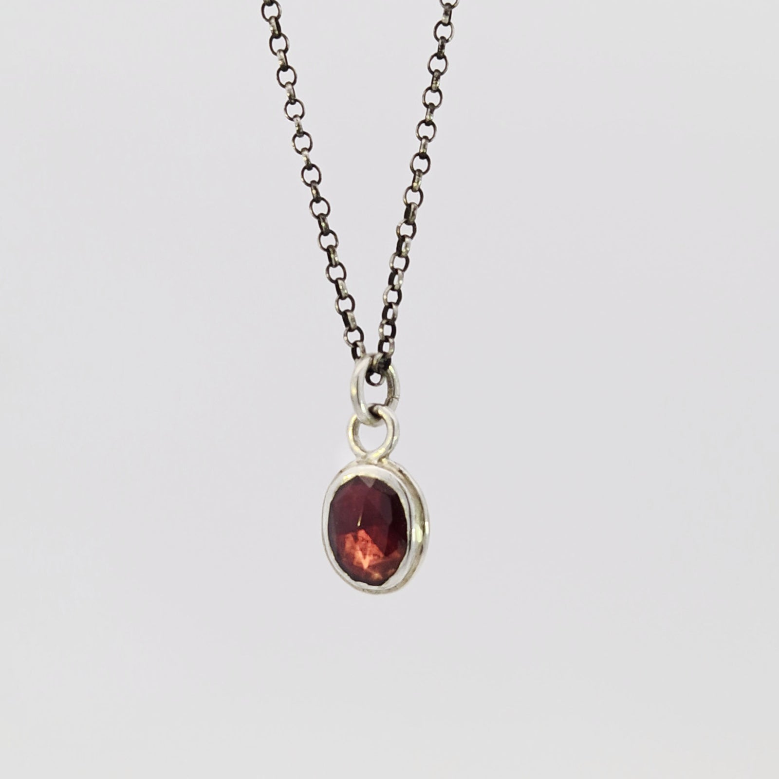 Garnet pendant in sterling silver bezel
