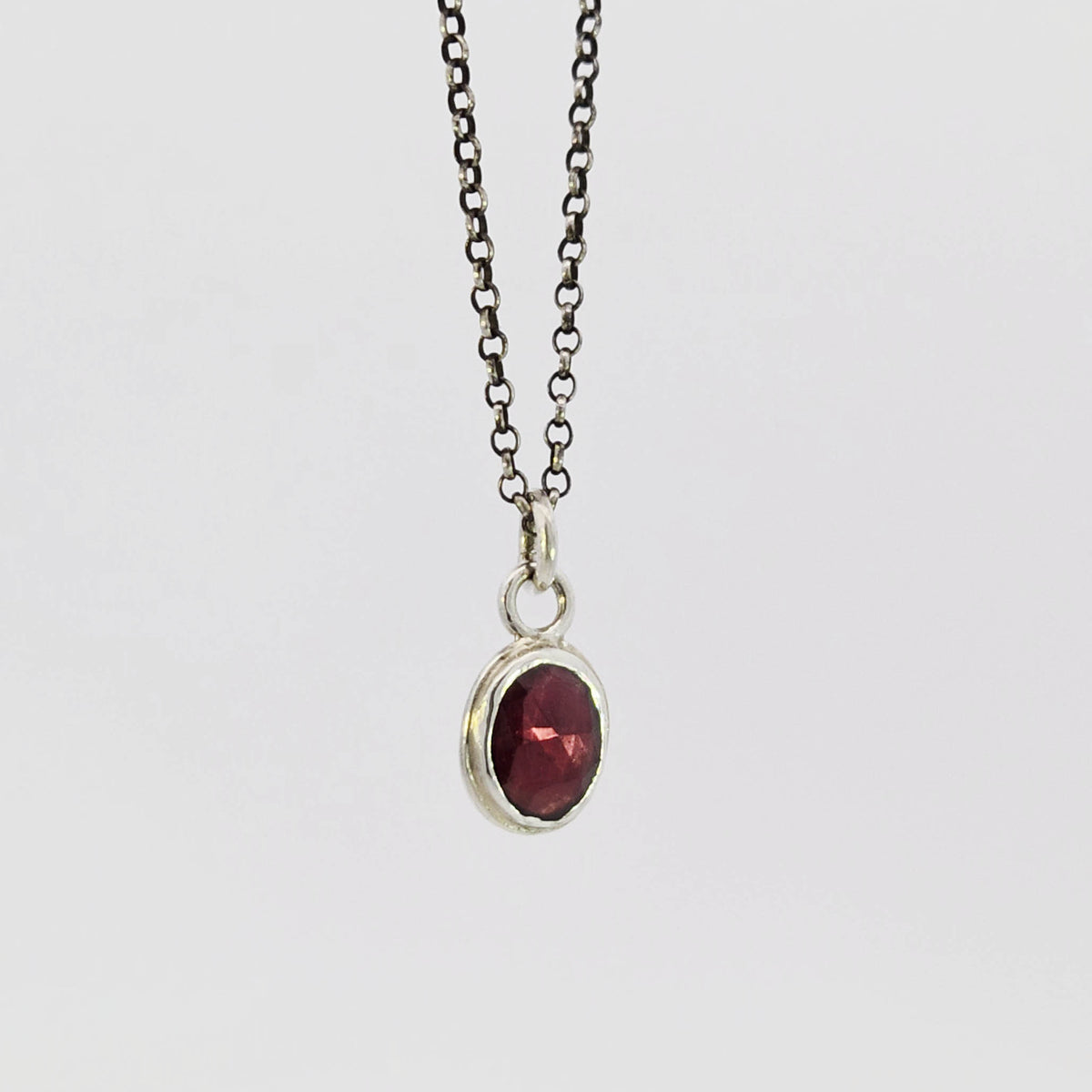 Garnet pendant in sterling silver bezel