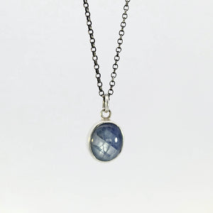 Light blue sapphire pendant in sterling silver bezel