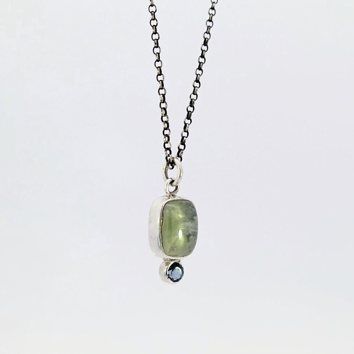 Prehnite and blue topaz pendant in sterling silver
