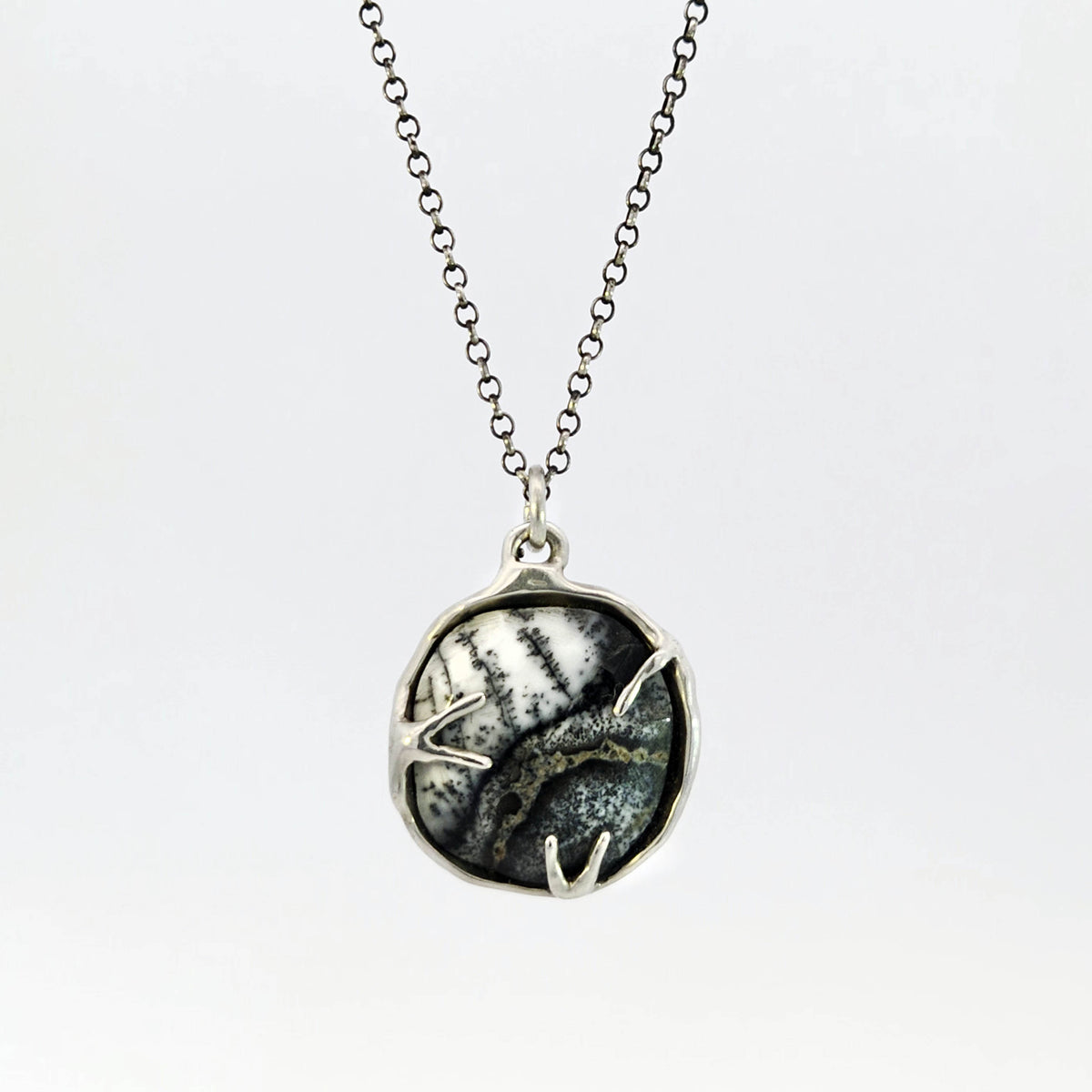 Dendritic opal pendant in hybrid bezel with decorative prongs