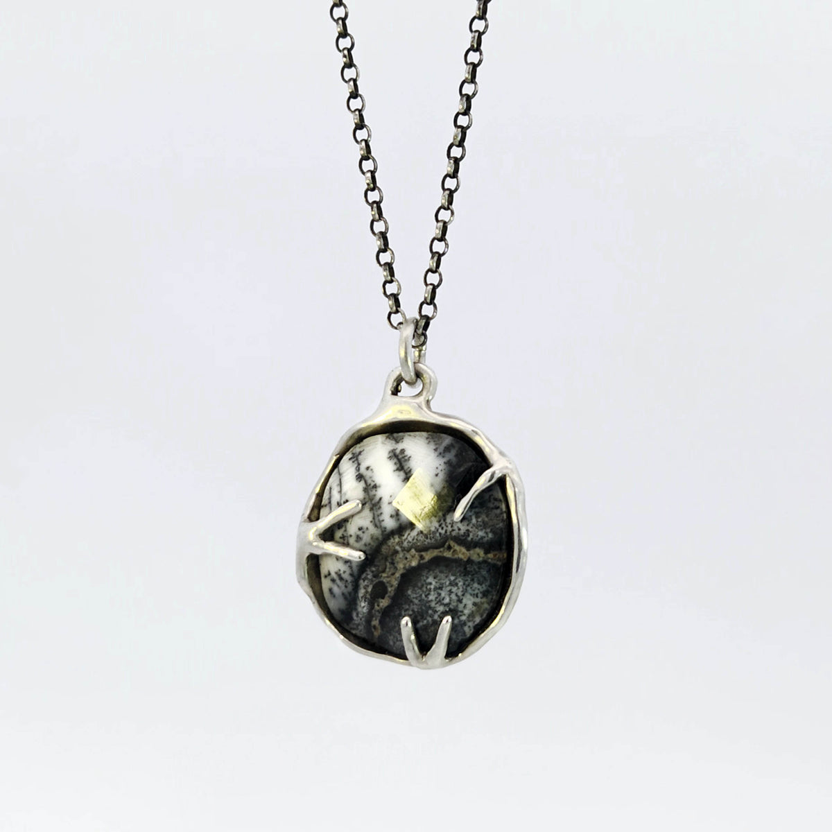 Dendritic opal pendant in hybrid bezel with decorative prongs