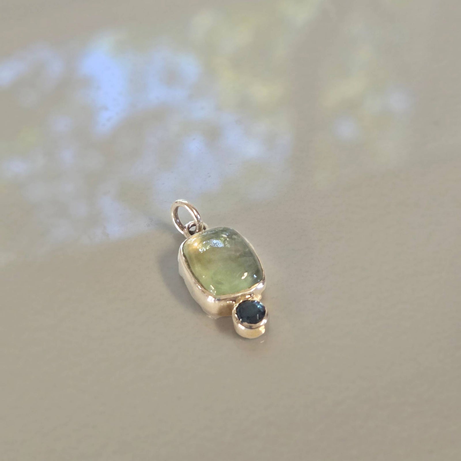 Prehnite and blue topaz pendant in sterling silver