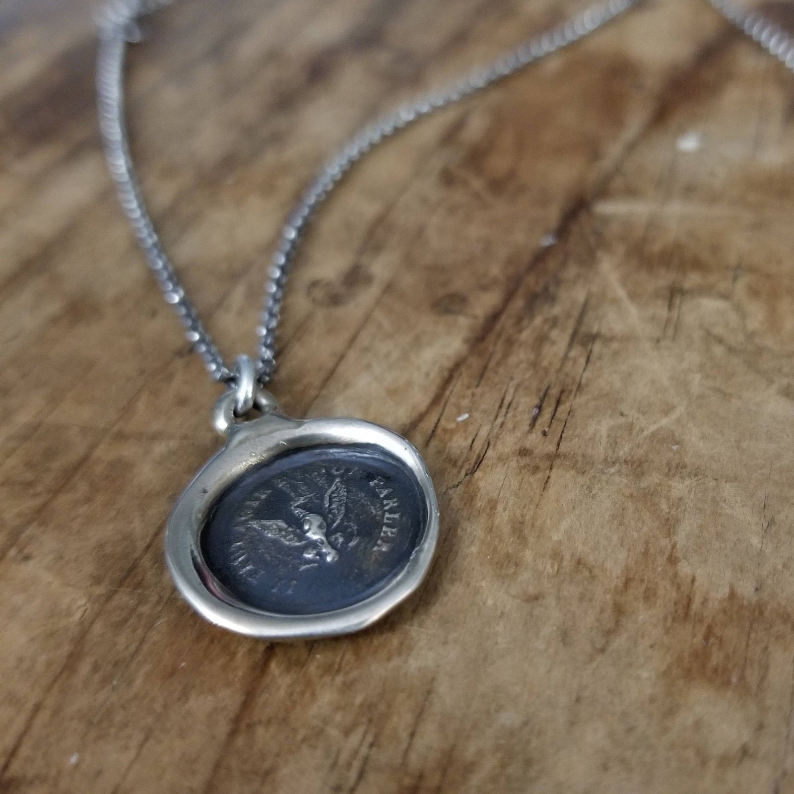 Eagle -  Deeds not words in bronze